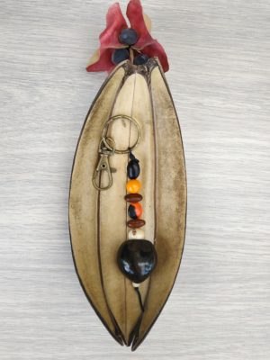 Porte-clés/bijoux de sac noix de bancoule noire tachetée dorée